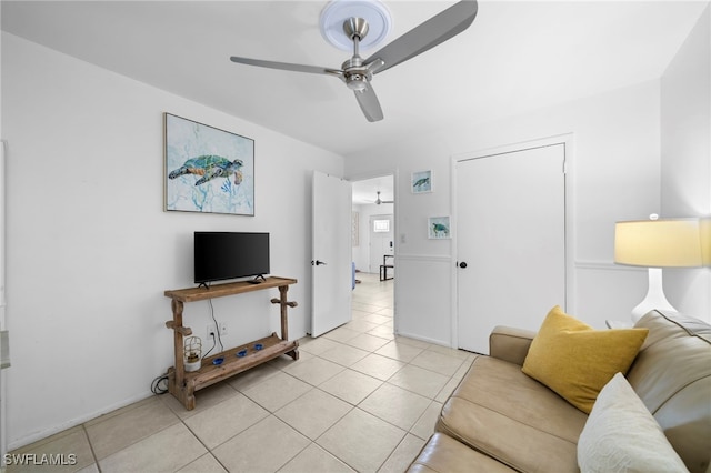 tiled living room featuring ceiling fan