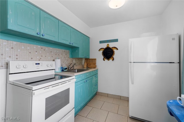 kitchen featuring light tile patterned flooring, white electric range, light countertops, freestanding refrigerator, and decorative backsplash