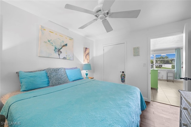 bedroom with baseboards and a ceiling fan