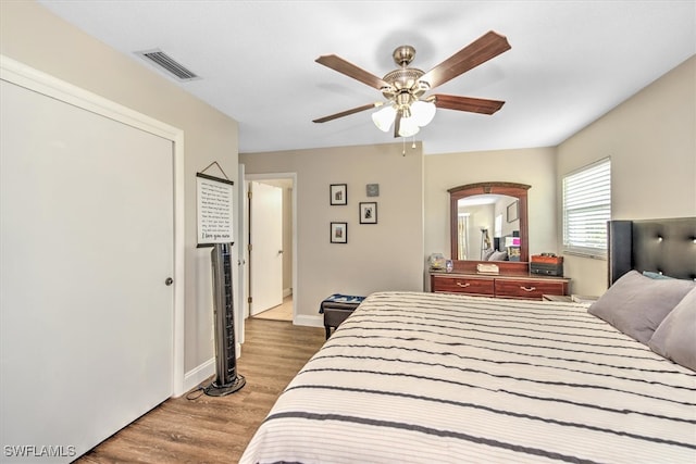 bedroom featuring ceiling fan and hardwood / wood-style flooring