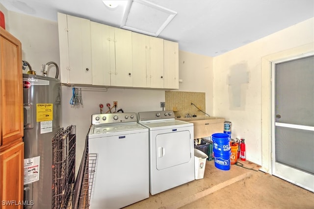 washroom featuring washing machine and dryer, cabinets, and electric water heater