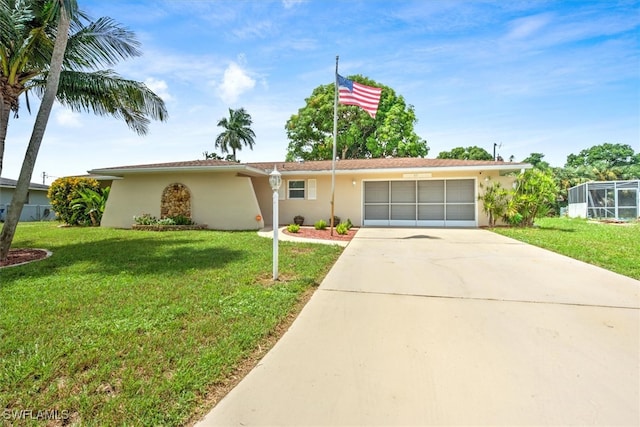 single story home with a garage and a front lawn