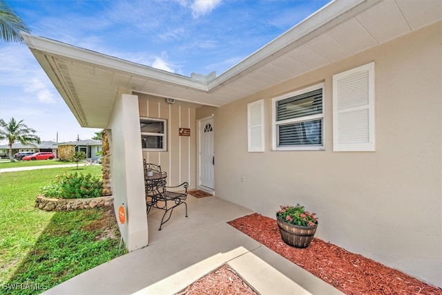 entrance to property with a yard