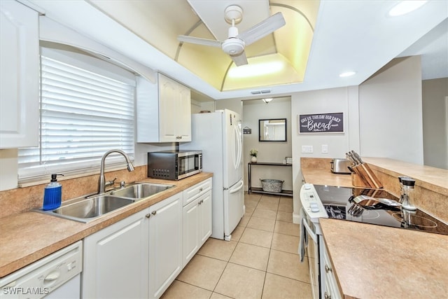 kitchen with ceiling fan, white cabinetry, light tile patterned floors, sink, and white appliances