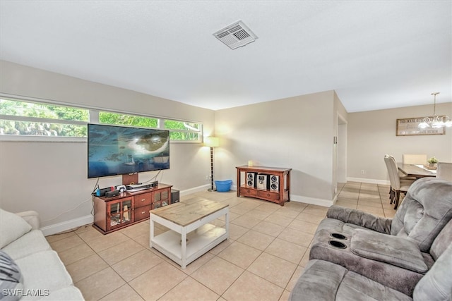 living room with an inviting chandelier and light tile patterned flooring