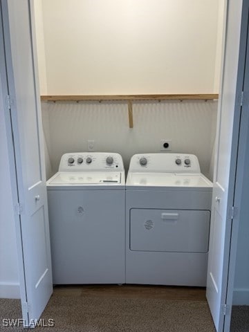 washroom featuring laundry area and separate washer and dryer