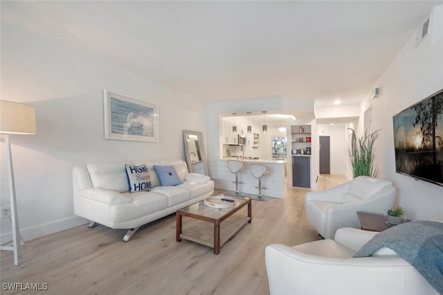 living room with light hardwood / wood-style floors