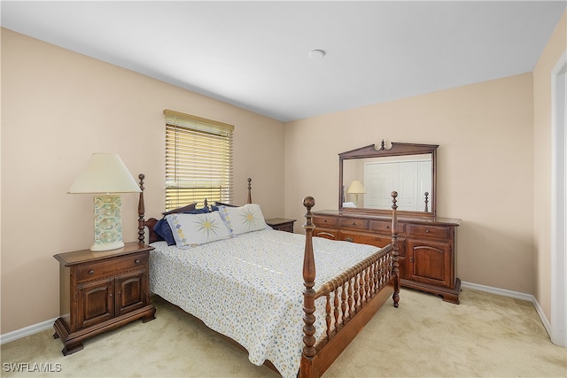 bedroom featuring light colored carpet