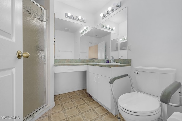 bathroom with vanity, toilet, and walk in shower