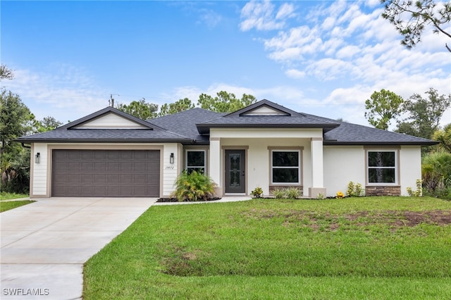 view of front of house featuring a front yard and a garage