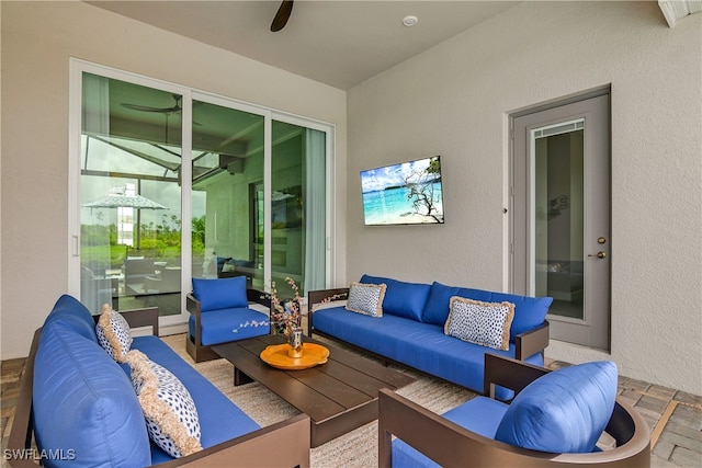 view of patio featuring ceiling fan and outdoor lounge area