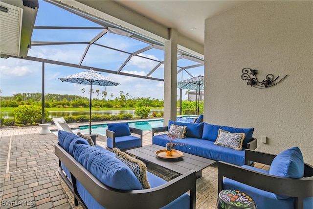 view of patio with an outdoor living space and glass enclosure