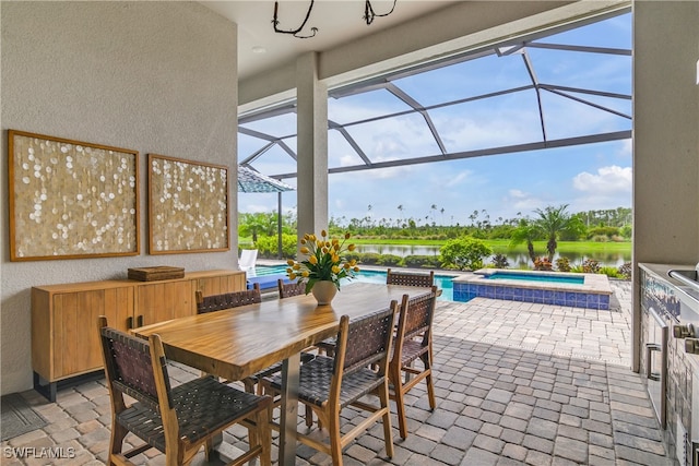 view of patio / terrace with glass enclosure, a water view, and a pool with hot tub