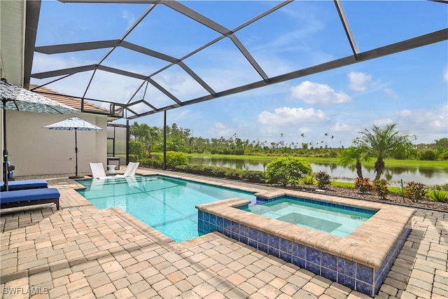 view of swimming pool with glass enclosure, an in ground hot tub, and a patio