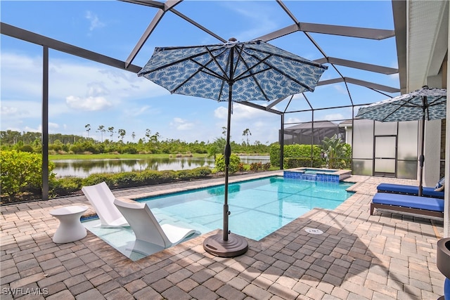 view of pool with glass enclosure, an in ground hot tub, and a patio area