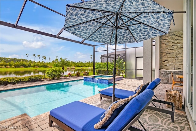 view of pool with a patio area, an in ground hot tub, a lanai, and a water view