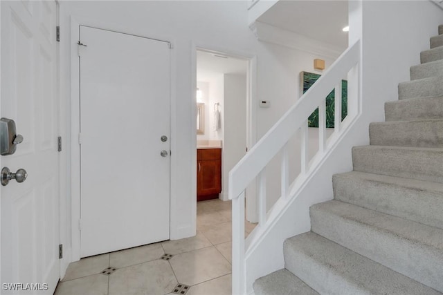 stairs with tile patterned flooring