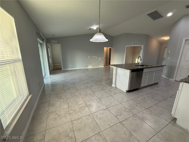 kitchen with pendant lighting, a kitchen island with sink, sink, stainless steel dishwasher, and white cabinetry