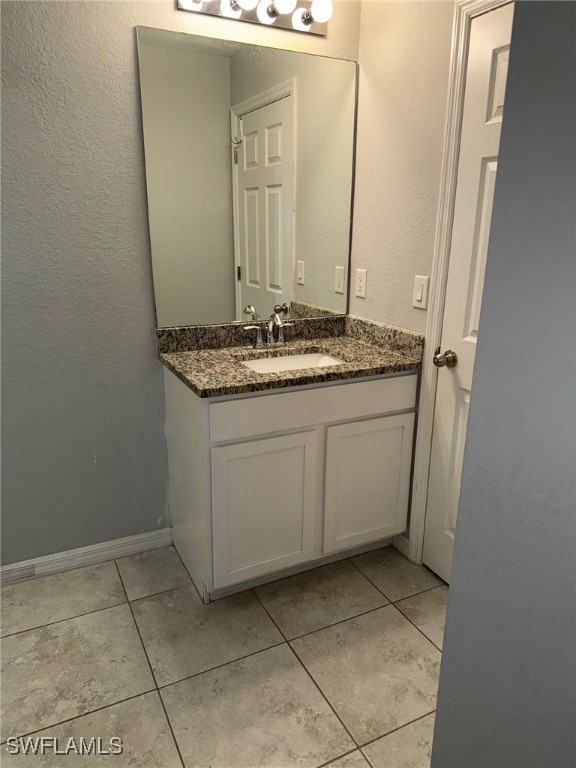 bathroom with vanity and tile patterned floors