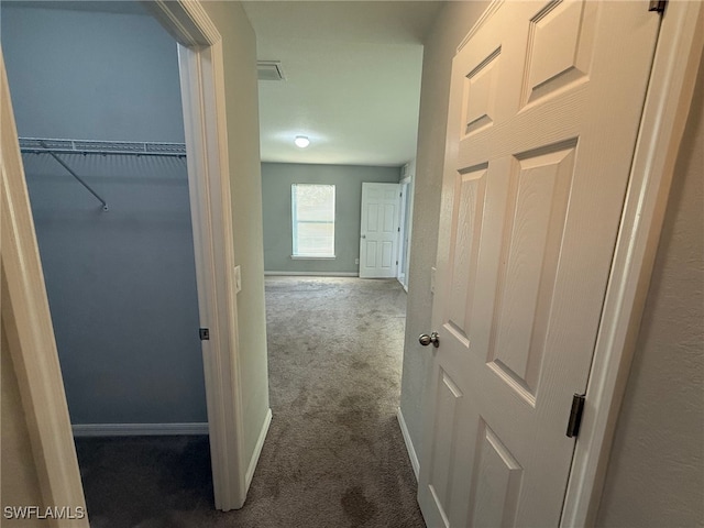 hallway featuring carpet flooring