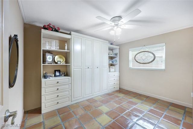 tiled bedroom with ceiling fan, a closet, and crown molding