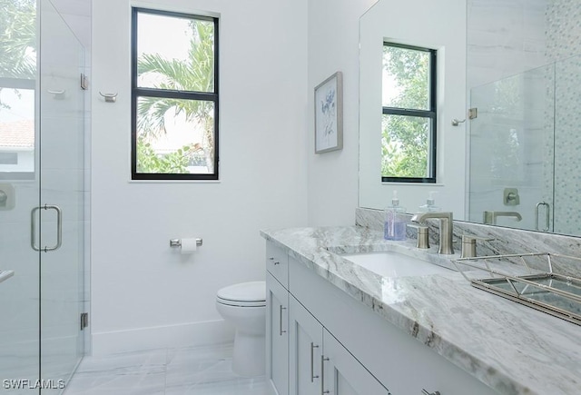 full bath featuring toilet, marble finish floor, a shower stall, and vanity