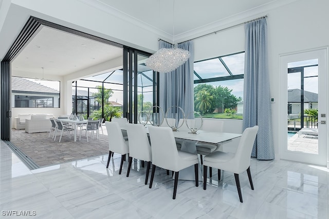 dining area with crown molding and a notable chandelier