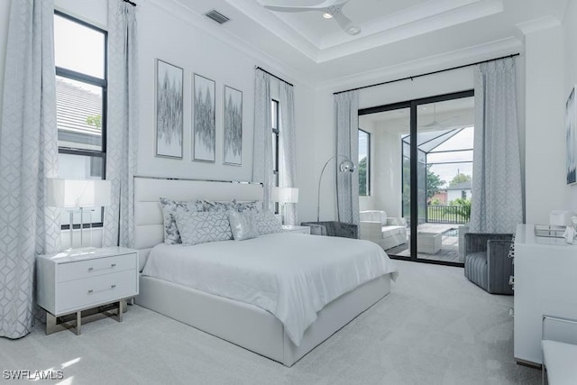 carpeted bedroom featuring a sunroom, access to outside, visible vents, and ornamental molding