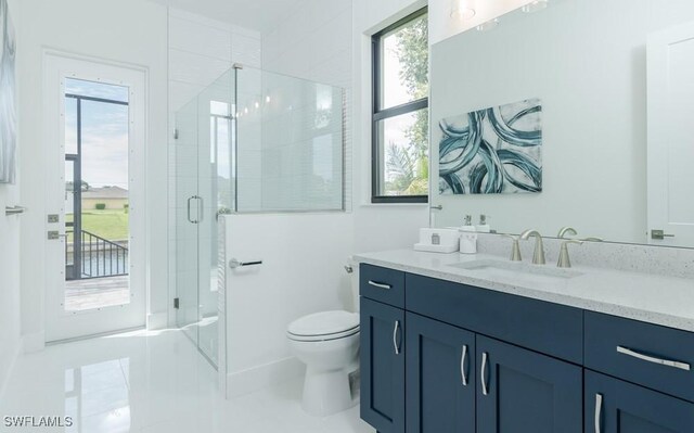 bathroom with tile patterned flooring, vanity, toilet, and a shower with door