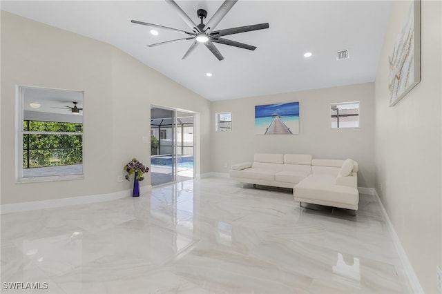 living room featuring plenty of natural light, lofted ceiling, and ceiling fan