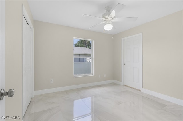 spare room featuring ceiling fan