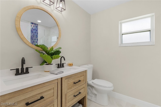 bathroom featuring a shower with shower curtain, vanity, toilet, and tile patterned flooring