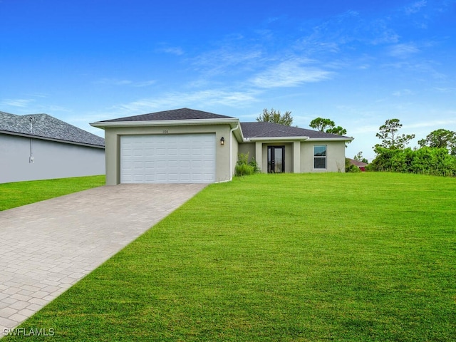 single story home featuring a garage and a front yard