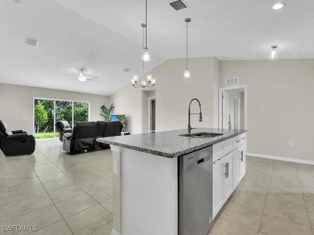 kitchen featuring sink, vaulted ceiling, stainless steel dishwasher, and light tile patterned floors