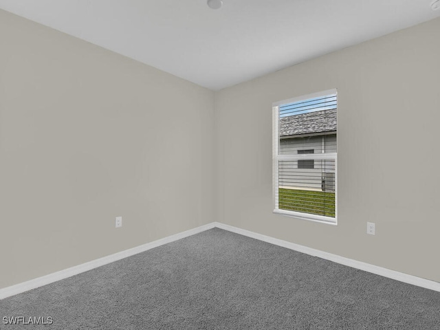 unfurnished room featuring carpet flooring