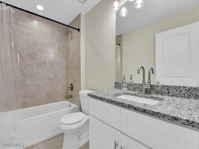 full bathroom with tile patterned flooring, shower / bath combination with curtain, toilet, and vanity