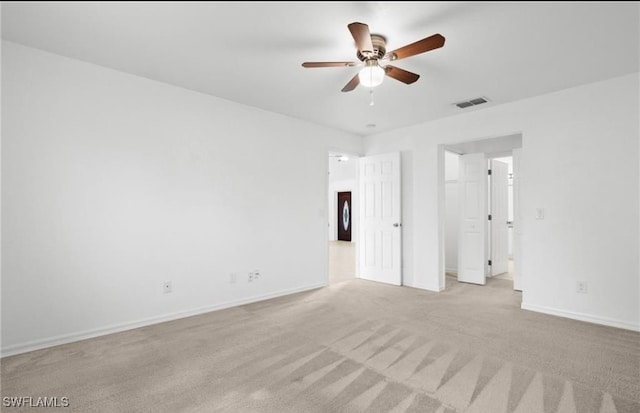 unfurnished bedroom featuring ceiling fan and light carpet