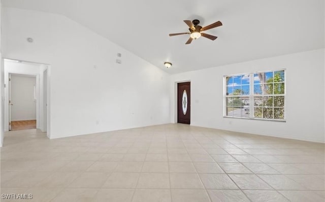 tiled empty room featuring high vaulted ceiling and ceiling fan