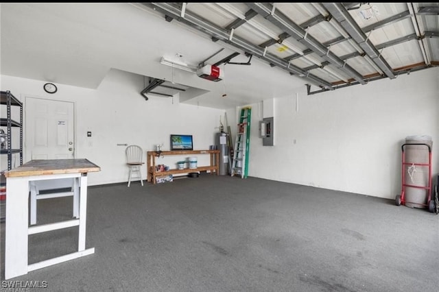 garage featuring gas water heater, a garage door opener, and electric panel