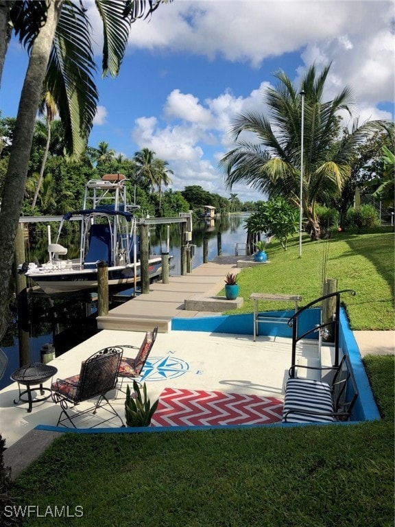 exterior space with a lawn and a water view