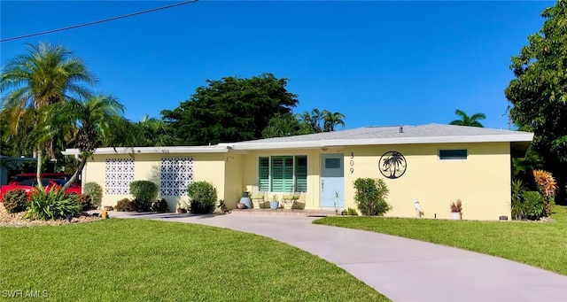 ranch-style home with a front yard