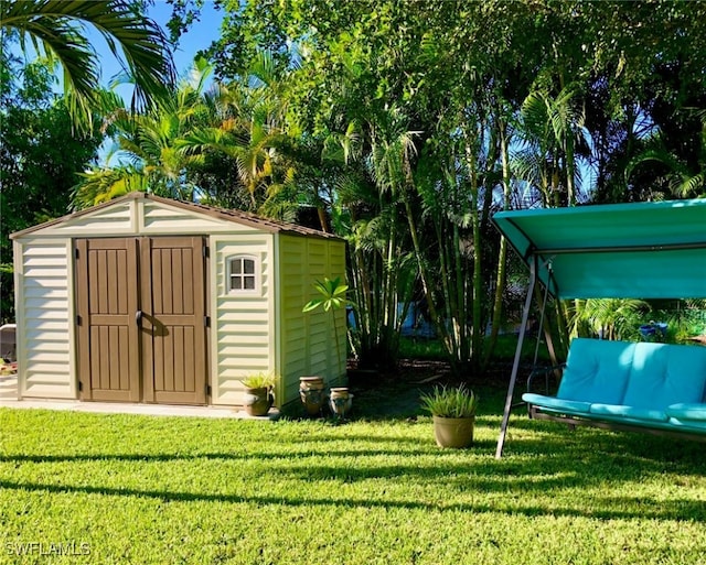 view of outbuilding featuring a yard