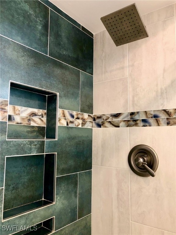 bathroom featuring tiled shower