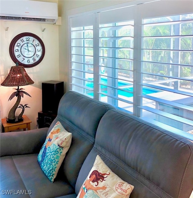 living room featuring a wall unit AC