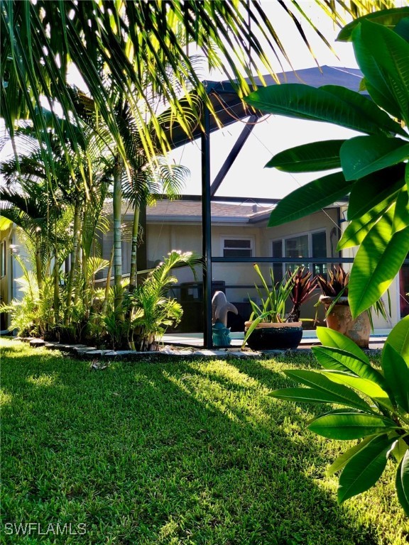 view of yard featuring a lanai