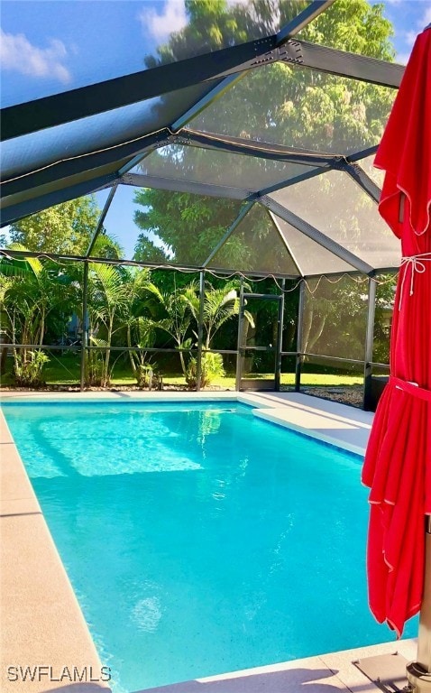 view of pool featuring a lanai