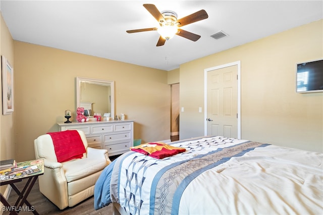 bedroom with ceiling fan and wood-type flooring