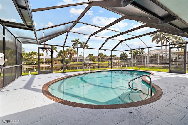 view of pool featuring a lanai, a patio, and a water view