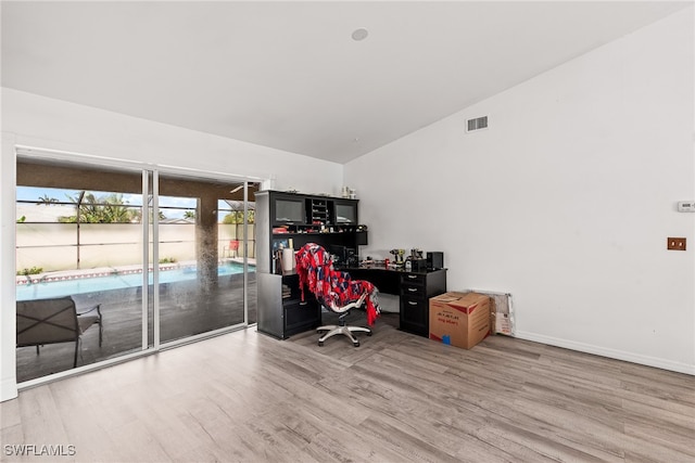 office space featuring wood-type flooring and lofted ceiling