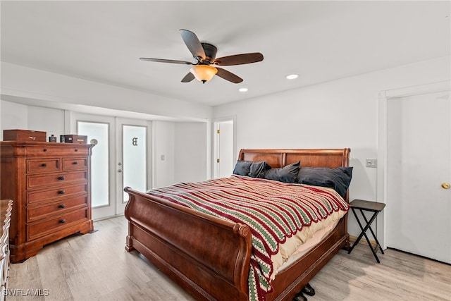 bedroom featuring light hardwood / wood-style flooring and ceiling fan